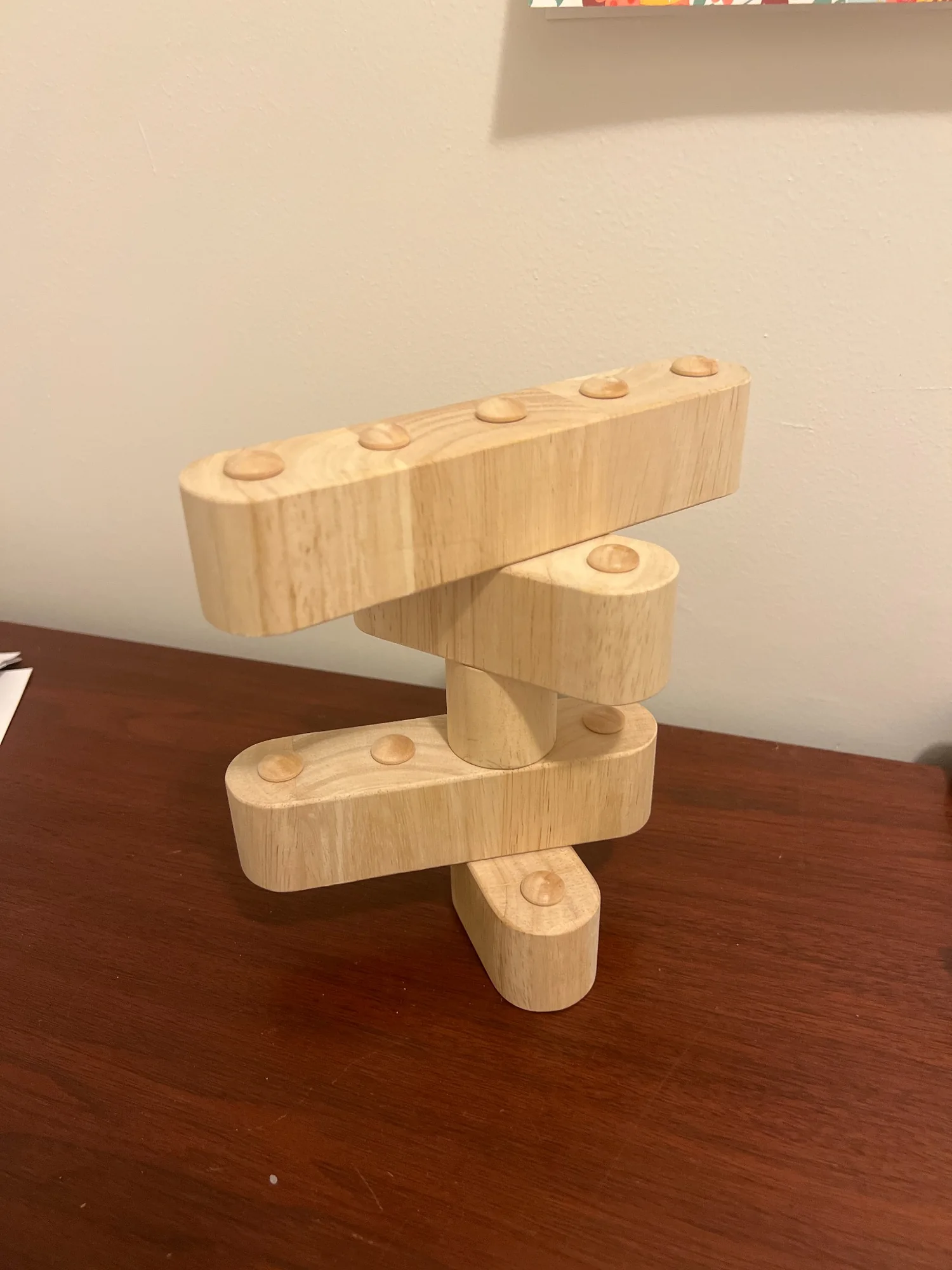 Real BoboBlox wooden blocks stacked into a tower on a tabletop